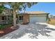 Charming single-Gathering home featuring a well-manicured lawn, brick accents, and attached two-car garage at 9125 Lowell Ct, Westminster, CO 80031