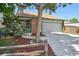 Charming single-Gathering home featuring a well-manicured front yard and attached two-car garage with lush green landscaping at 9125 Lowell Ct, Westminster, CO 80031