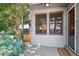 Inviting front porch with neutral siding, trimmed windows, manicured landscaping, and a 'welcome' mat at 9125 Lowell Ct, Westminster, CO 80031