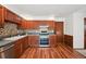 Spacious kitchen showcasing wood cabinets, modern appliances, and a clean, functional layout at 9125 Lowell Ct, Westminster, CO 80031