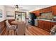 Cozy kitchen and dining area featuring wood floors and a sliding glass door to outdoor living space at 9125 Lowell Ct, Westminster, CO 80031