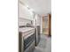 Convenient laundry room with modern washer and dryer and white cabinets for storage at 9125 Lowell Ct, Westminster, CO 80031