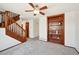 Inviting living room with hardwood stairs and shelves, offering a comfortable and stylish space at 9125 Lowell Ct, Westminster, CO 80031