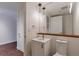 Modern bathroom with a vanity, large mirror, and updated fixtures at 1750 Wewatta St # 1102, Denver, CO 80202