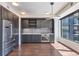 Sleek, modern kitchen with stainless steel appliances and gray cabinets at 1750 Wewatta St # 1102, Denver, CO 80202