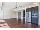 Spacious living area with hardwood floors and a modern kitchen at 1750 Wewatta St # 1102, Denver, CO 80202