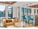 Stylish lounge featuring comfortable seating, modern lighting, and panoramic city views at 1750 Wewatta St # 1102, Denver, CO 80202