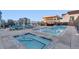 Rooftop pool area with hot tub, comfortable seating, and clear railing at 1750 Wewatta St # 1102, Denver, CO 80202