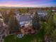 Expansive backyard with a large deck, outdoor seating, and lush green lawn at 9980 Newton Ct, Westminster, CO 80031