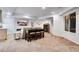 Finished basement area featuring bar seating, TV, and neutral decor at 9980 Newton Ct, Westminster, CO 80031