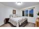 Comfortable bedroom with a wrought iron bed frame and ample natural light at 9980 Newton Ct, Westminster, CO 80031