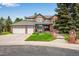 Charming brick home with mature trees, well-manicured lawn, and a three-car garage adds curb appeal at 9980 Newton Ct, Westminster, CO 80031