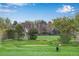 Scenic golf course view with lush green fairway and mature trees, perfect for a relaxing day on the course at 9980 Newton Ct, Westminster, CO 80031