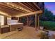 Outdoor patio with a hot tub and garden overlooking the lawn at 9980 Newton Ct, Westminster, CO 80031
