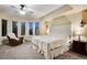 Serene main bedroom with bay windows, sitting area, and a tufted headboard at 9980 Newton Ct, Westminster, CO 80031