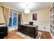 This is an office with wood floors, white baseboards, and cream-colored walls at 9980 Newton Ct, Westminster, CO 80031