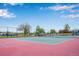 Well-maintained tennis court with colorful surface and secure fencing, ideal for tennis enthusiasts at 9980 Newton Ct, Westminster, CO 80031