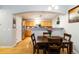 Kitchen open to dining area features stainless appliances, granite countertops, and ample cabinet space at 4222 S Blackhawk Cir # 6C, Aurora, CO 80014