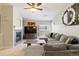 Comfortable living room with fireplace, ceiling fan, and ample seating at 4222 S Blackhawk Cir # 6C, Aurora, CO 80014