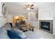 Open living area with fireplace, connecting to the kitchen and dining areas at 4222 S Blackhawk Cir # 6C, Aurora, CO 80014