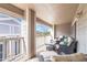 A covered patio space with comfortable wicker furniture and an open view at 4222 S Blackhawk Cir # 6C, Aurora, CO 80014