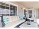 A covered patio featuring wicker furniture, throw pillows, and a table at 4222 S Blackhawk Cir # 6C, Aurora, CO 80014