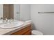 Bathroom featuring a neutral vanity and tile, plus a walk-in shower at 902 Anaconda Ct, Castle Rock, CO 80108