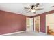Spacious bedroom with a ceiling fan and an attached bathroom at 902 Anaconda Ct, Castle Rock, CO 80108