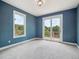 Bedroom with natural light and a private balcony overlooking lush greenery at 902 Anaconda Ct, Castle Rock, CO 80108