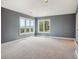 Sunlit bedroom with views, featuring new carpet, recessed lighting, and natural light at 902 Anaconda Ct, Castle Rock, CO 80108