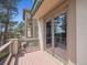 Deck with wood flooring and metal railing featuring sliding glass doors to the interior at 902 Anaconda Ct, Castle Rock, CO 80108
