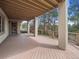 Large deck with wood flooring overlooking the tree lined landscape at 902 Anaconda Ct, Castle Rock, CO 80108