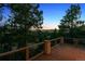 Stunning mountain views from the wooden deck with metal and wood railing at 902 Anaconda Ct, Castle Rock, CO 80108