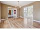 Open dining room with hardwood floors and views into multiple rooms at 902 Anaconda Ct, Castle Rock, CO 80108