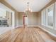 Dining room boasting hardwood floors, bright windows, and chandelier at 902 Anaconda Ct, Castle Rock, CO 80108