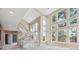 Bright entryway featuring a spiral staircase with large windows showcasing beautiful greenery and natural light at 902 Anaconda Ct, Castle Rock, CO 80108