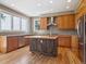 Bright kitchen featuring stainless steel appliances, wood countertops, and an island at 902 Anaconda Ct, Castle Rock, CO 80108