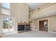 Large living room with fireplace, high ceilings, and lots of natural light at 902 Anaconda Ct, Castle Rock, CO 80108