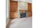 Cozy living room featuring built-in shelves, cabinets and a fireplace at 902 Anaconda Ct, Castle Rock, CO 80108