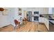 Eat-in kitchen features modern appliances, white cabinets, and a stylish dining table for casual meals at 1998 Foxtail Ln # B, Lafayette, CO 80026