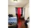 Bedroom featuring hardwood floors, a closet, and plenty of natural light at 20308 E 48Th Dr, Denver, CO 80249