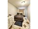 Bedroom with a comfortable bed, matching dresser, neutral colors, and tiled floors at 20308 E 48Th Dr, Denver, CO 80249