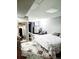 Bedroom with a large mirror, tiled floors, neutral colors, and a comfortable bed at 20308 E 48Th Dr, Denver, CO 80249