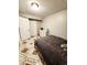 Bedroom with a comfortable bed, matching dresser, neutral colors, and tiled floors at 20308 E 48Th Dr, Denver, CO 80249