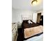 Neutral toned bedroom featuring a dresser and nightstand at 20308 E 48Th Dr, Denver, CO 80249