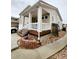 Well-kept two-story home featuring a covered front porch, complemented by a landscaped front yard at 20308 E 48Th Dr, Denver, CO 80249