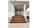 Inviting front porch with well-maintained wooden steps leading to a charming entrance at 20308 E 48Th Dr, Denver, CO 80249