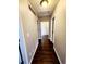 Hallway with hardwood floors leading to additional rooms at 20308 E 48Th Dr, Denver, CO 80249