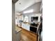 Bright kitchen features granite countertops, stainless steel appliances, and hardwood floors at 20308 E 48Th Dr, Denver, CO 80249