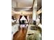 Eat in dining room area with large granite countertop island and hardwood floors at 20308 E 48Th Dr, Denver, CO 80249